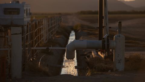 Groundwater gushes into a cement canal near the Fondomonte farm in Vicksburg, Arizona.