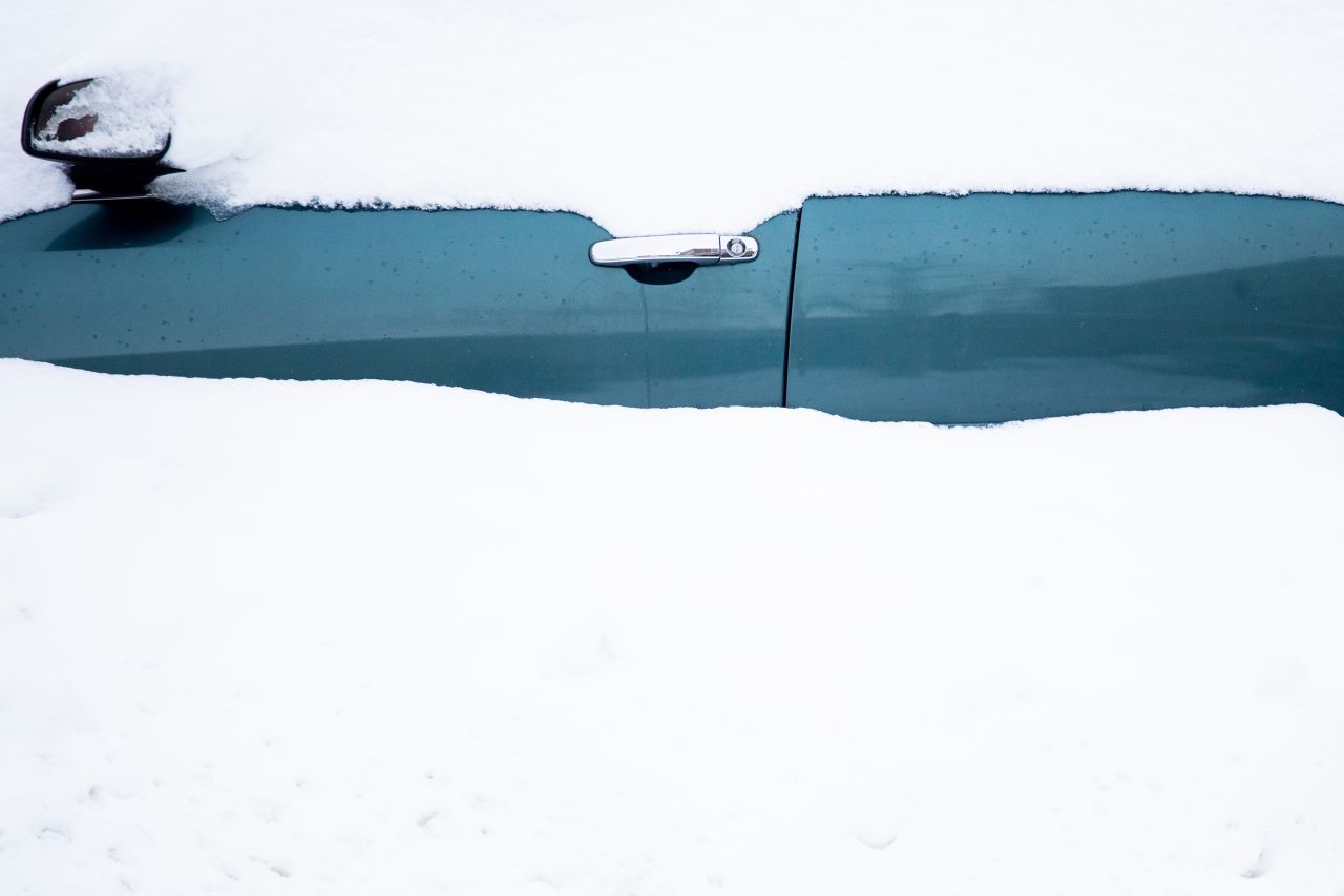 A car sits in a snowdrift in Buffalo, New York, on Friday, November 18. <a href=