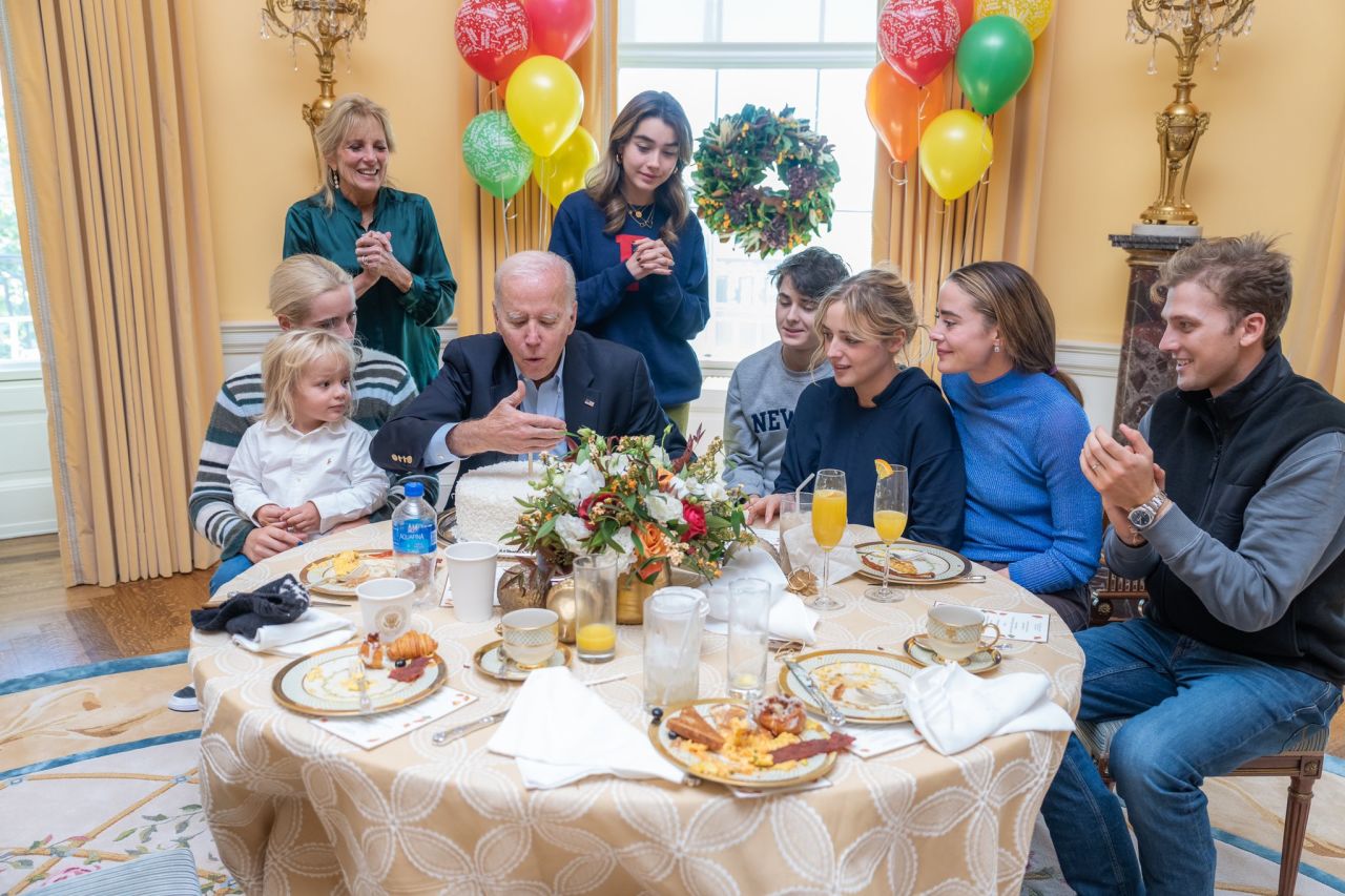 US President Joe Biden blows out the candle on his coconut birthday cake in this photo <a href=