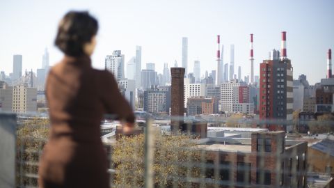 Zaldaña looks out on Manhattan, where her family still lives, from her new apartment in Queens. 