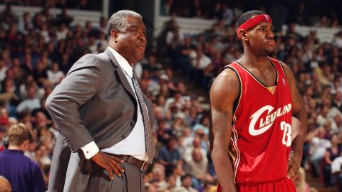 (From left to right) Head coach Paul Silas and LeBron James of the Cleveland Cavaliers look on during the game against the Sacramento Kings at Arco Arena on October 29, 2003, in Sacramento, California. 