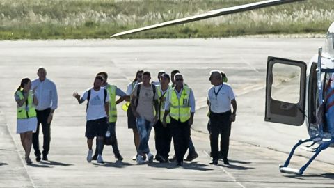 Messi and Di Maria prepare to board a helicopter at the Islas Malvinas international airport before heading to their respective homes, in Rosario, Santa Fe province, Argentina.