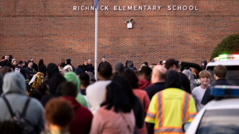 Students and police gather outside of Richneck Elementary School after a shooting, Friday, Jan. 6, 2023 in Newport News, Va.
