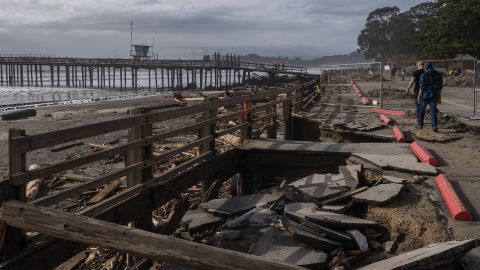 A section of a parking lot sits sunken Sunday after a storm at Seacliff State Beach in Aptos, California.