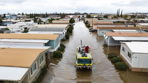 This aerial view shows rescue crews assisting stranded residents in a flooded neighborhood in Merced, California, Tuesday.