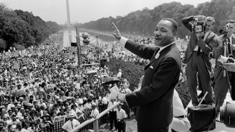 Civil rights leader Martin Luther King Jr. waves to supporters on August 28, 1963, on the Mall in Washington. His speech spoke of Black and White people sitting together 