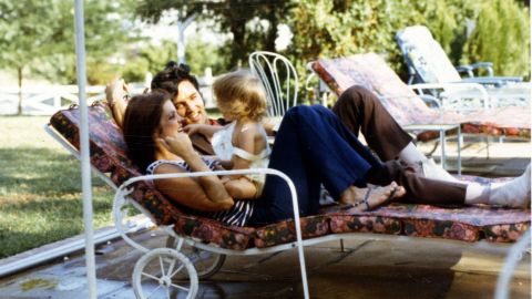 Priscilla Presley, Lisa Marie Presley, and Elvis Presley in 1968. 
