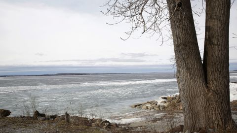 The Lake Champlain shoreline on February 16. The lake near the access area is covered with ice, but officials are warning anglers to stay off the lake because unseasonably warm temperatures have made it unsafe. 
