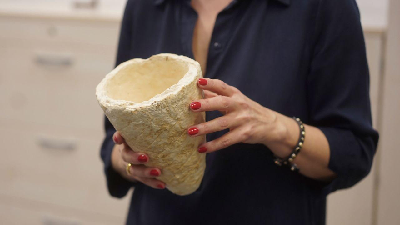 Vera Meyer, a scientist at the Berlin Institute of Biotechnology, holds a vessel made of scale sponge. The institute hopes to produce clothing, packaging and building material from fungal cultures. 