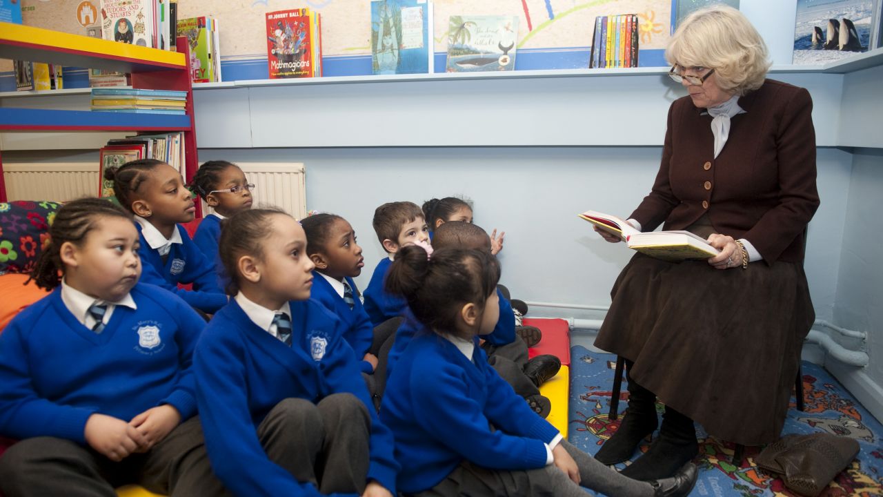 Camilla reads to primary school students in London in January 2012. 