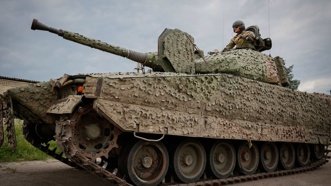 A Ukrainian soldier rides an armored vehicle near Bakhmut on June 25, the day after Prigozhin's attempted mutiny.