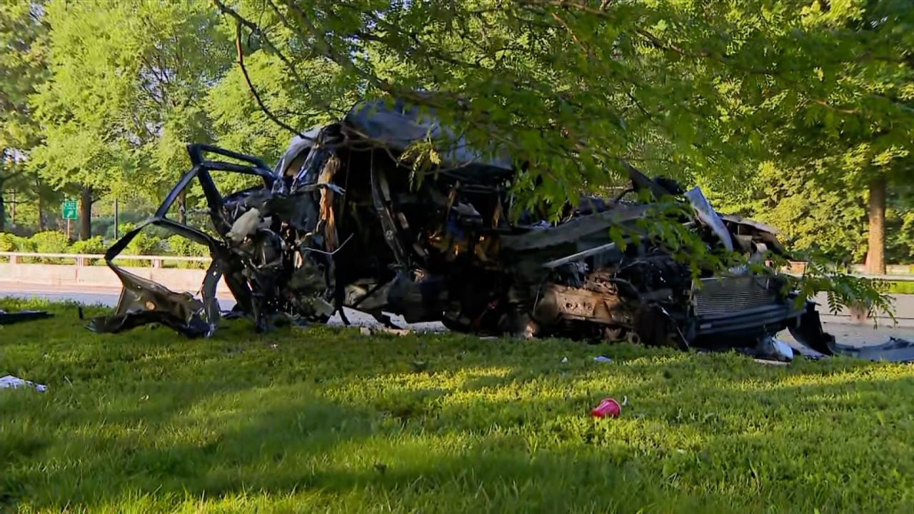 The wreckage of an SUV that crashed into the bus.