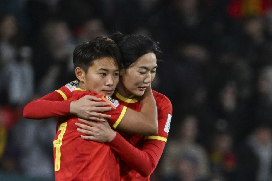 Chinese forward Wang Shuang, left, celebrates with Yang Lina after scoring against England.