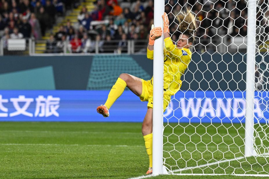 US goalkeeper Alyssa Naeher collides with the post.