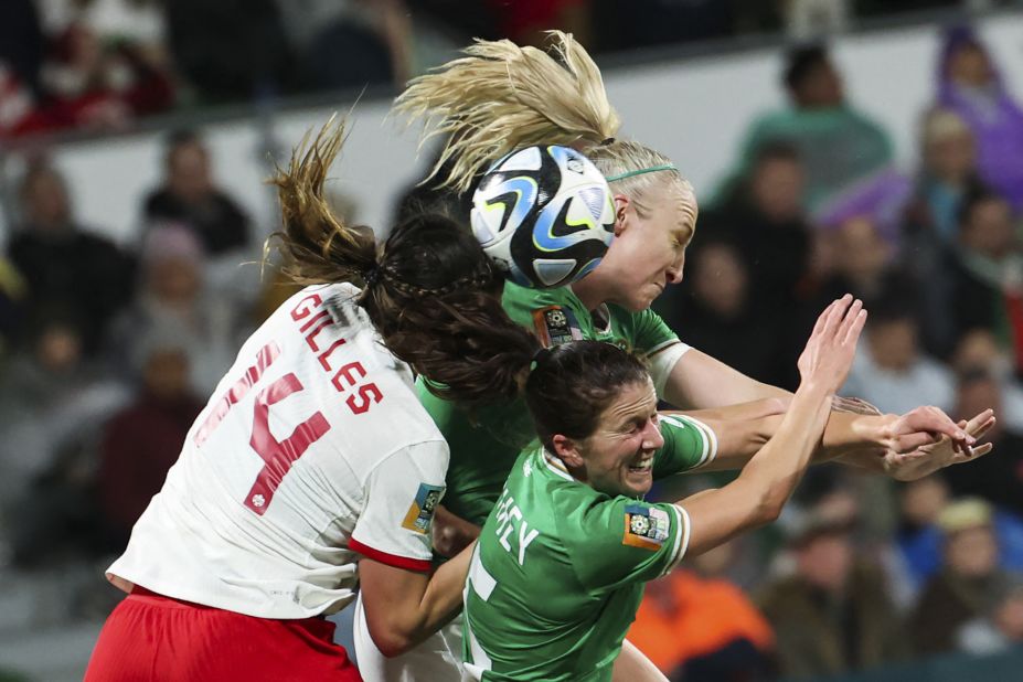 Canada's Vanessa Gilles competes for a header with Ireland's Niamh Fahey, bottom, and Louise Quinn during a match on July 26. <a href=
