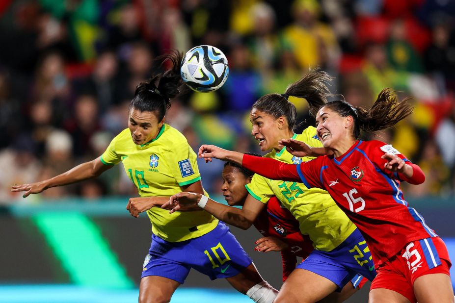Brazil's Marta, left, heads the ball during a match against Panama on July 24. <a href=