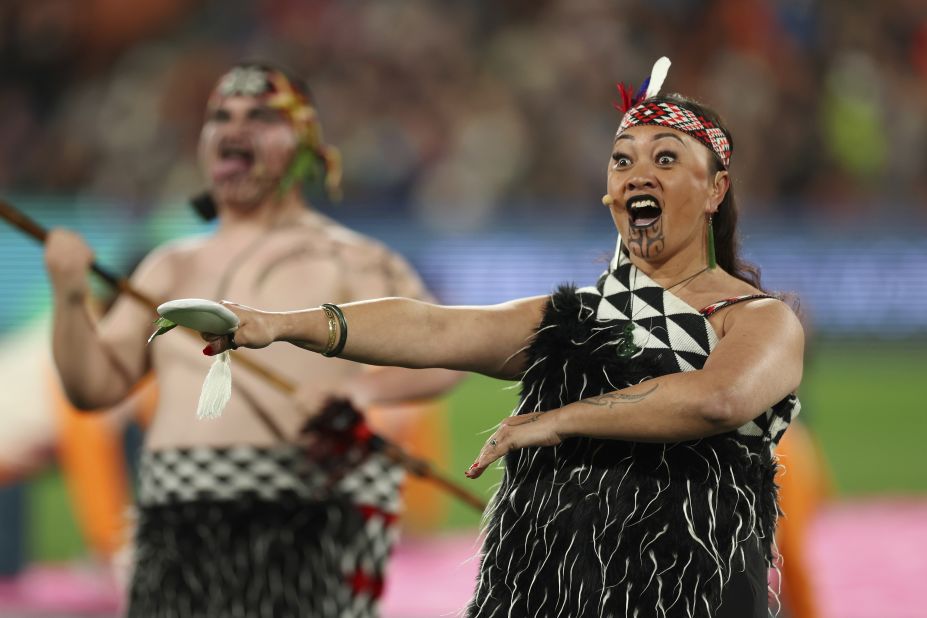 People in Indigenous dress perform during a welcome ceremony that was held before Norway-Switzerland.