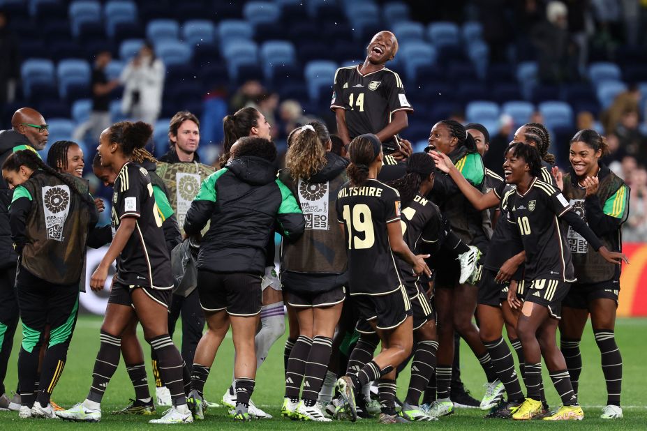 Jamaican players celebrate on July 23, after their 0-0 draw against France earned them their country's first-ever point in the Women's World Cup.
