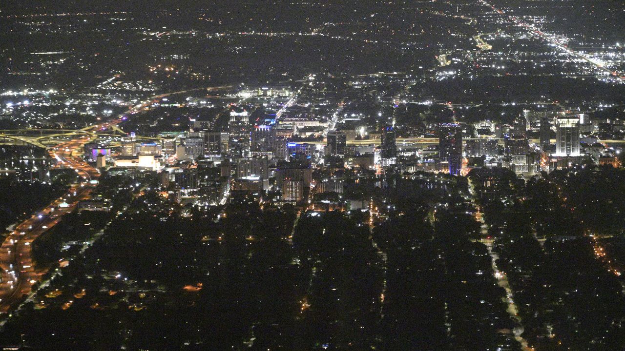 An aerial perspective of the downtown nighttime skyline is viewed on July 20, 2023, in Orlando, Florida.