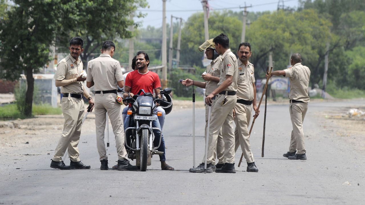 Haryana Police conduct checks near Nuh Chowk on August 1, 2023 in Gurugram, India. 
