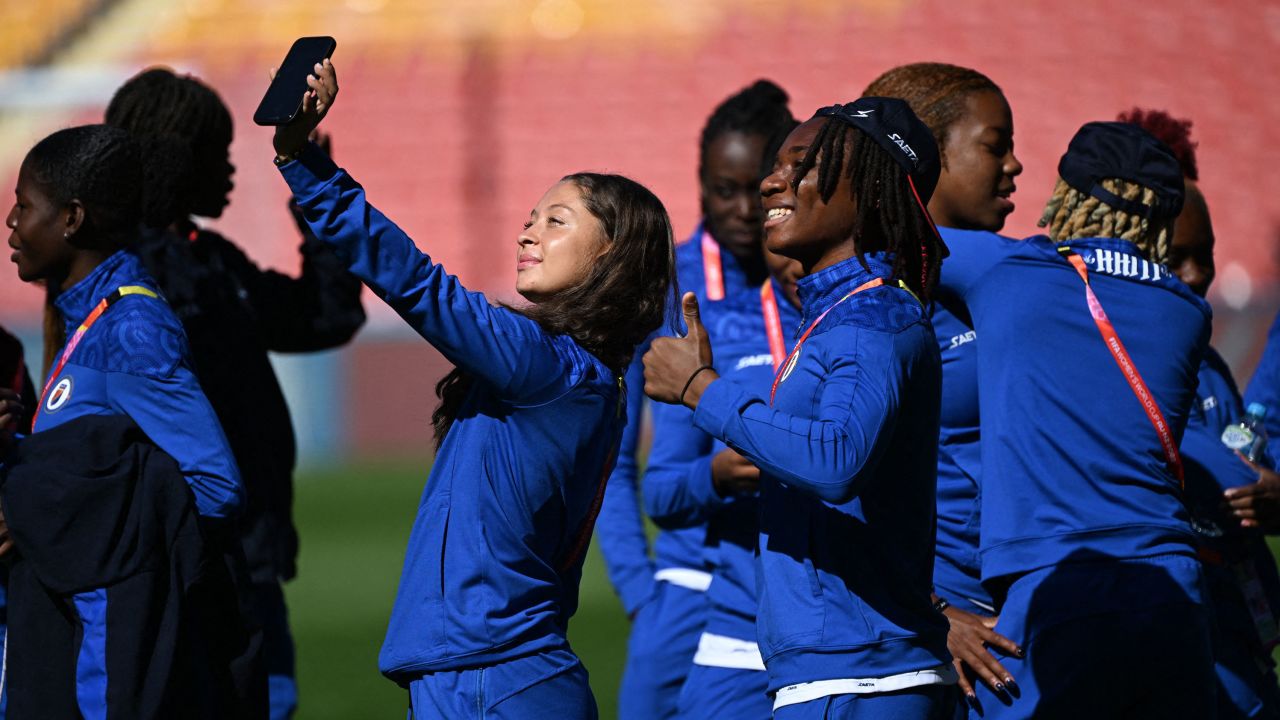 Haiti's Noa Ganthier holds a phone for a selfie in Brisbane Stadium, Australia, at the Women's World Cup on July 21, 2023.