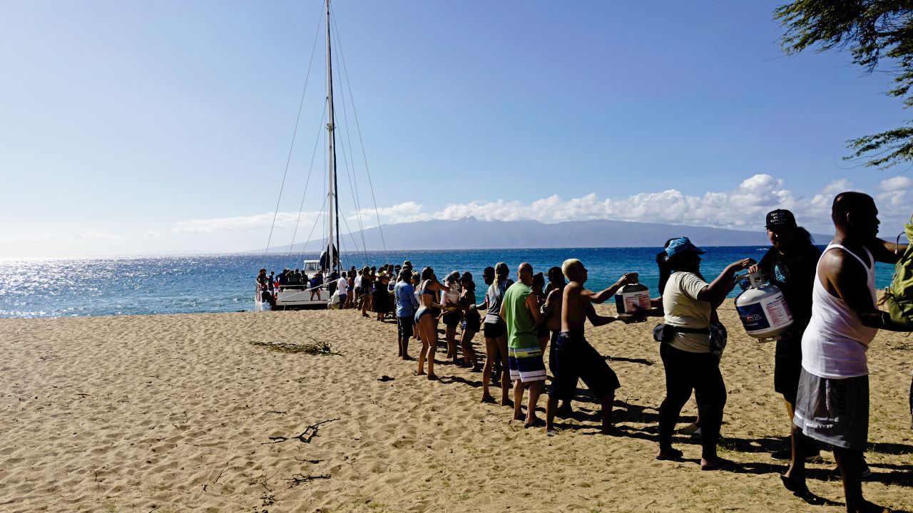 Supplies are being unloaded onto Kahekili Beach Park from the Ocean Spirit, just north of Lahaina.