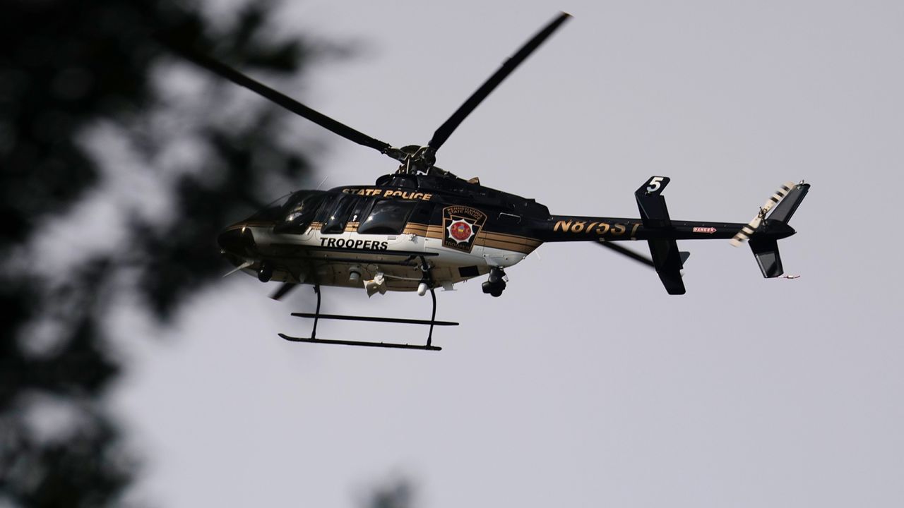 A Pennsylvania State Police helicopter hovers over the perimeter of a search zone for Cavalcante on September 8, 2023.