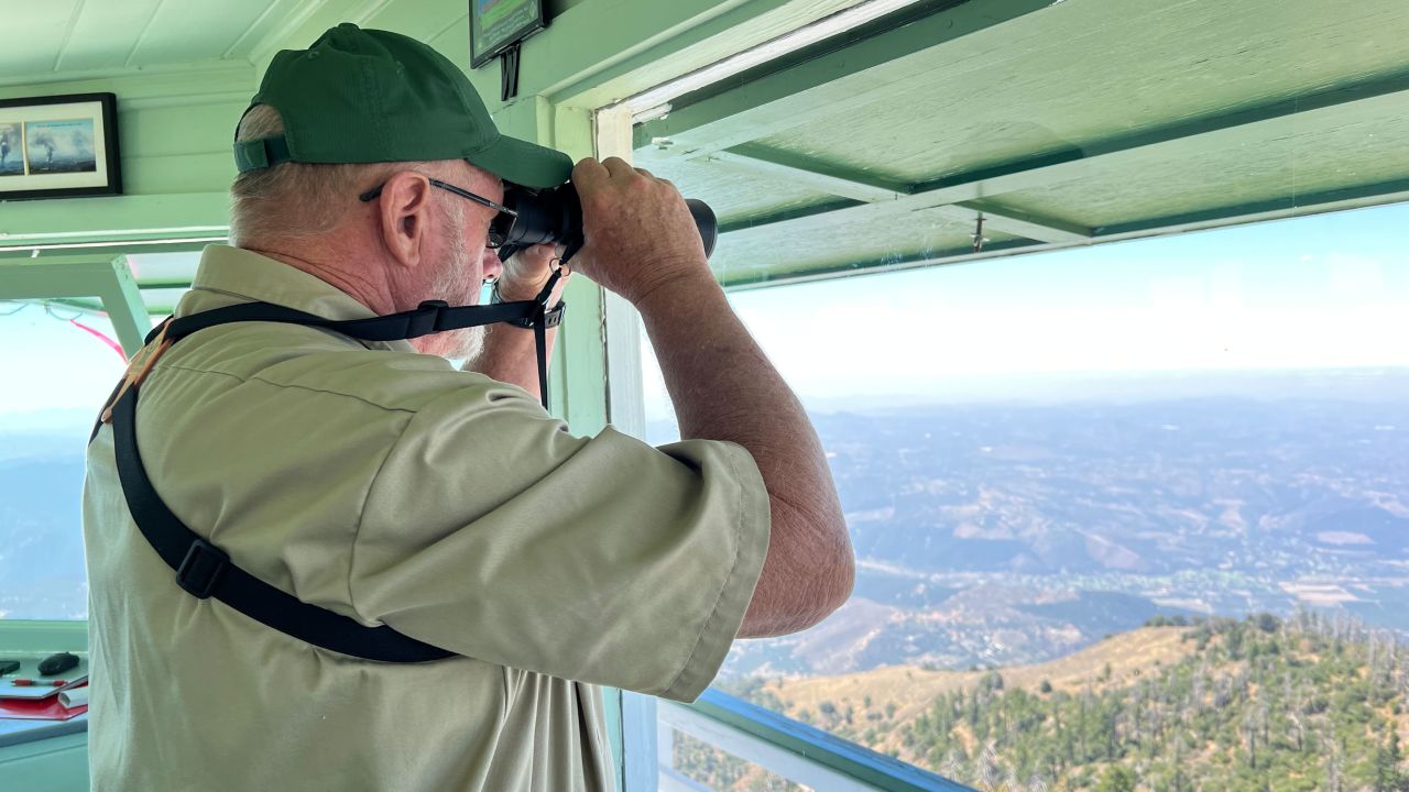 Bill Angel, a volunteer with the Forest Fire Lookout Association, watches for nascent wildfires.