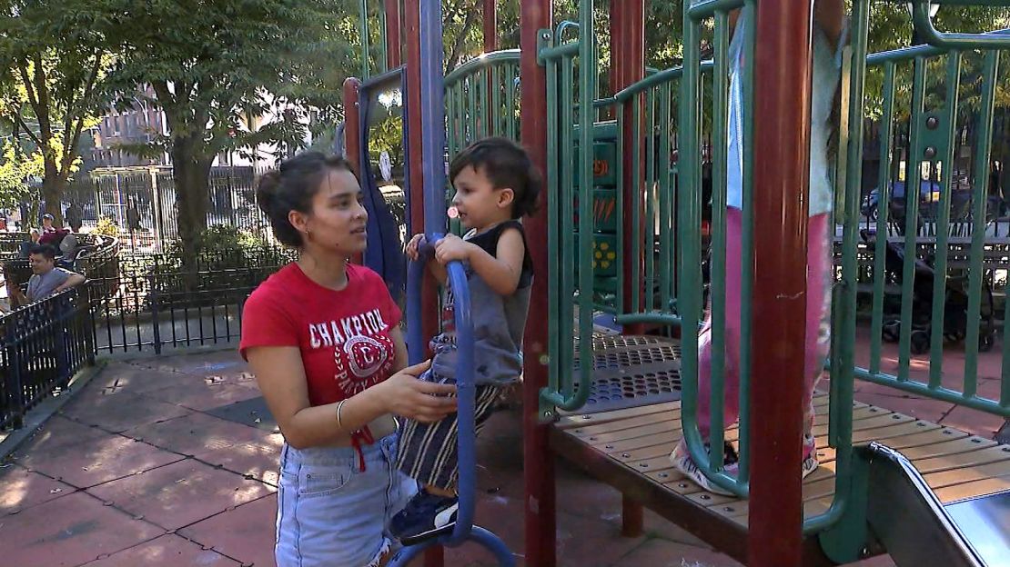 Diana Amezquita, from Bogota, Colombia, plays with her children at a playground on Manhattan's west side.