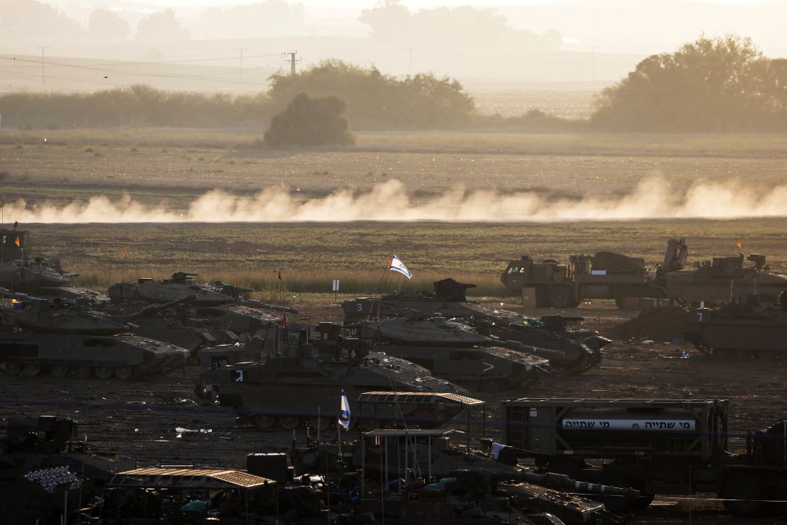 A formation of Israeli tanks and other military is positioned near Israel's border with the Gaza Strip, in southern Israel October 20, 2023.