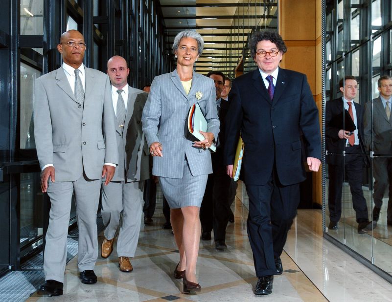 In June 2005, Lagarde joined the French government as Minister for Foreign Trade under French President Jacques Chirac. <br />She is seen here with French Minister of Economy Thierry Breton (R) arriving at a press conference in Paris, France. 