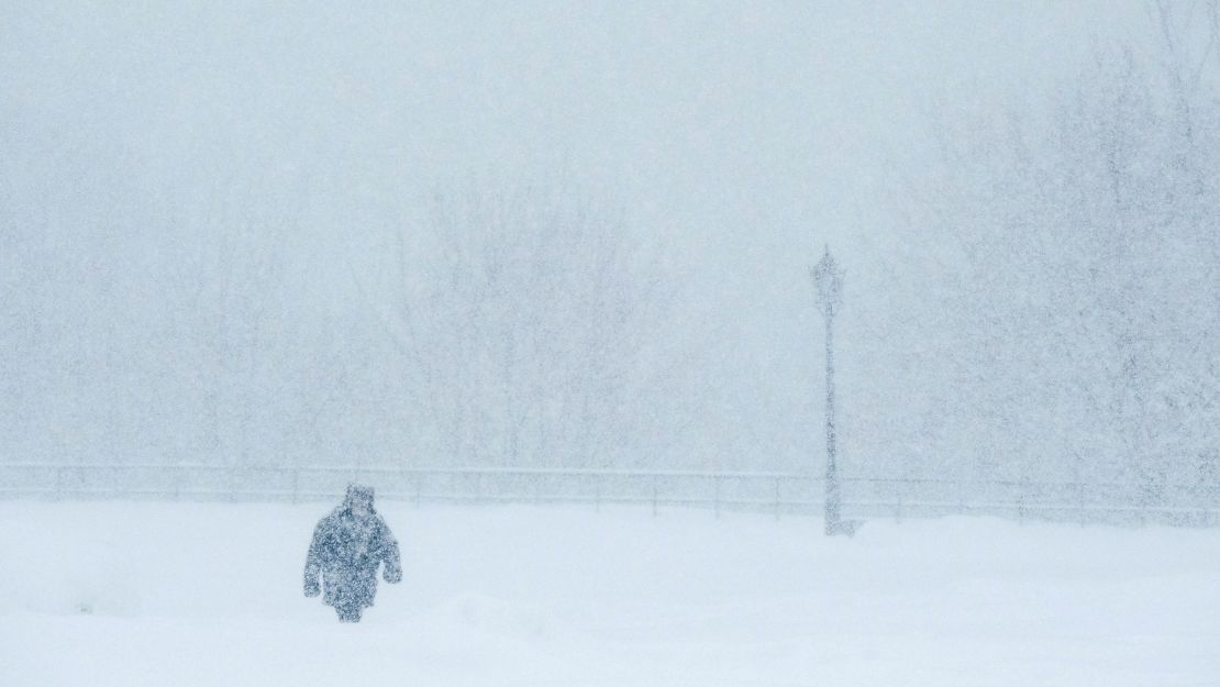Russians know a lot about blizzard survival. A man walks during a winter storm in Moscow in February 2018.